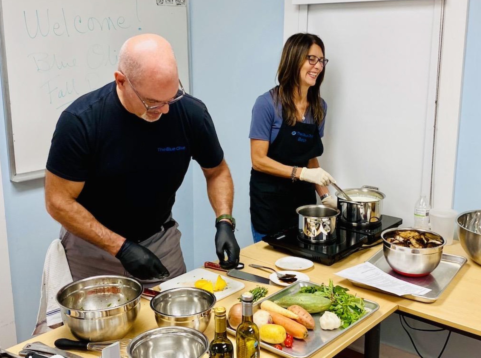 john and beth cooking at the autumn recipes event at the pawling library